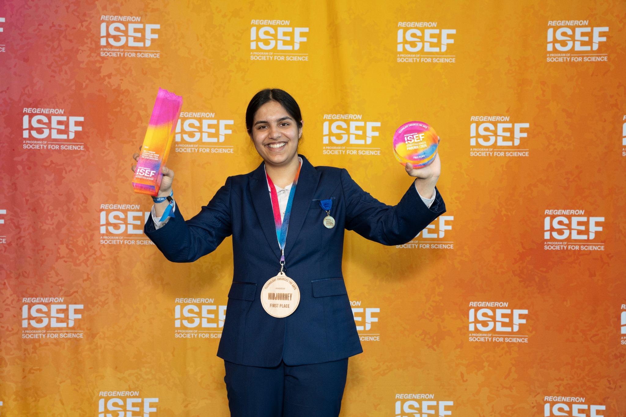 Anusha holding her Regeneron ISEF awards
